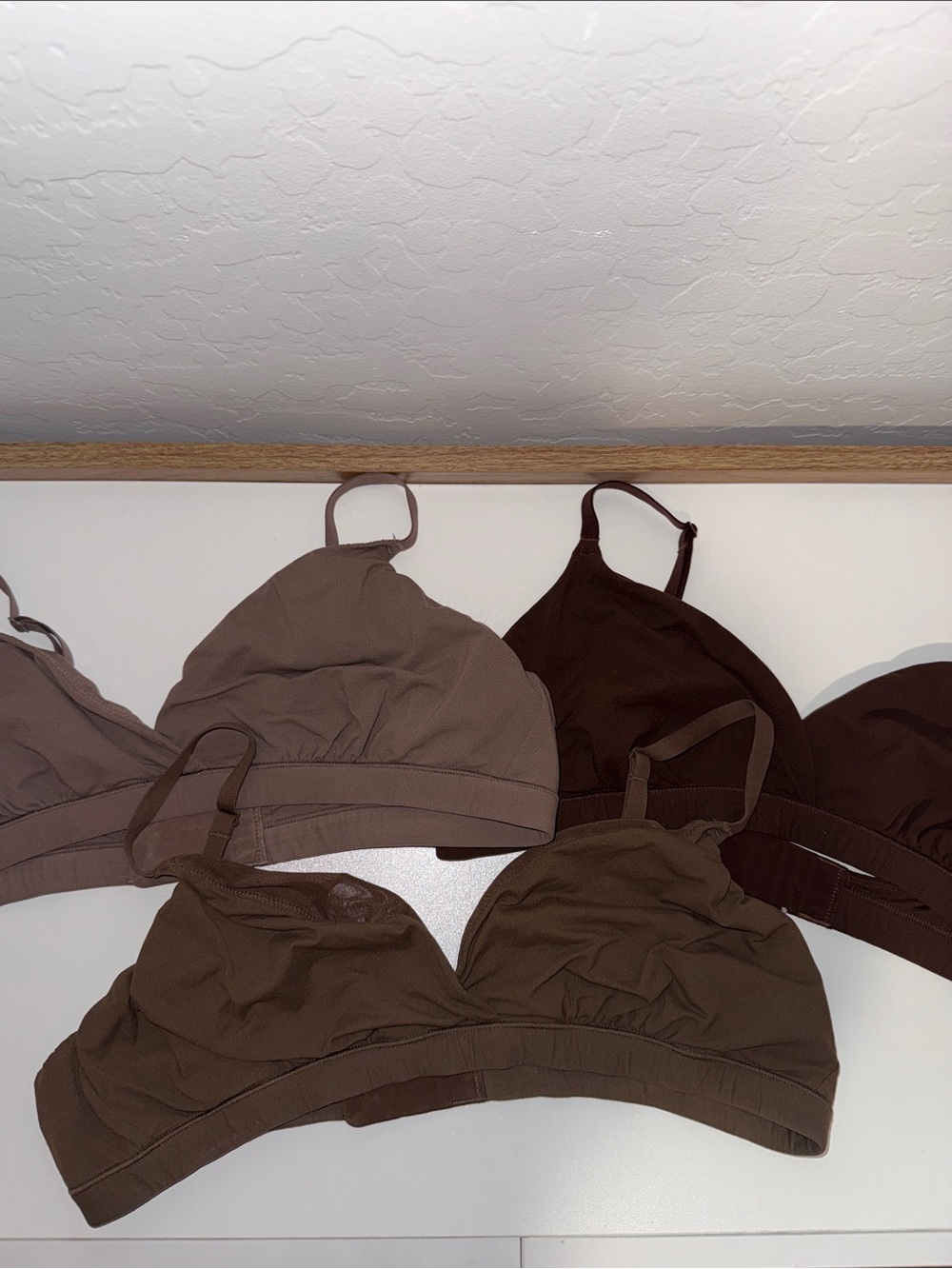 SKIMS Soft Wireless Bralettes in Brown & Espresso